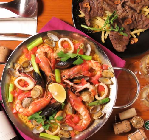 Seafood paella with organic tomatoes and carefully selected ingredients