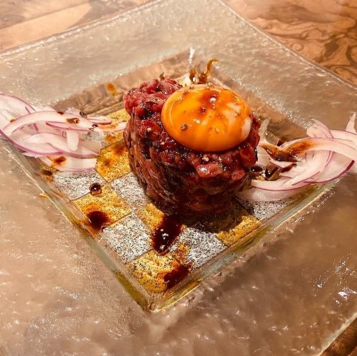 Wagyu beef tartare topped with egg yolk