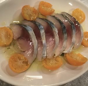 Marinated seasonal fish and kumquats