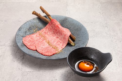 1 piece of grilled sirloin with egg yolk and truffle