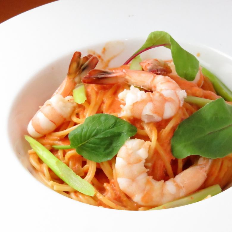 Unwaveringly popular since its opening.Rich tomato cream sauce with shrimp and asparagus