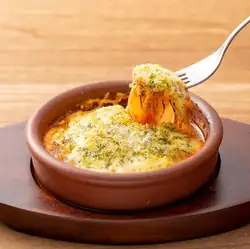 Mackerel and eggplant simmered in tomato sauce, with herb and cheese bake.
