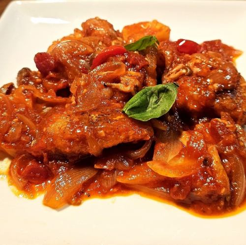 Chicken stewed in tomato sauce