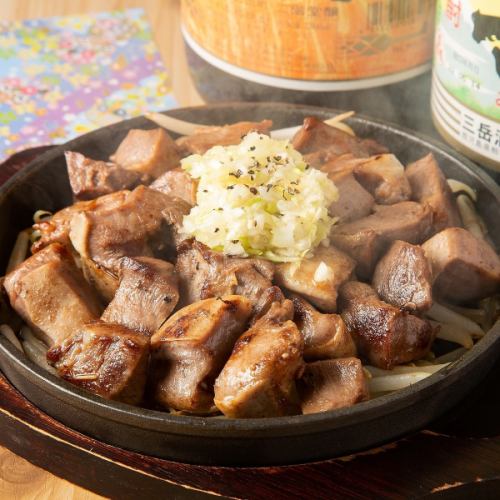 Kyushu pork tongue steak on a hot plate