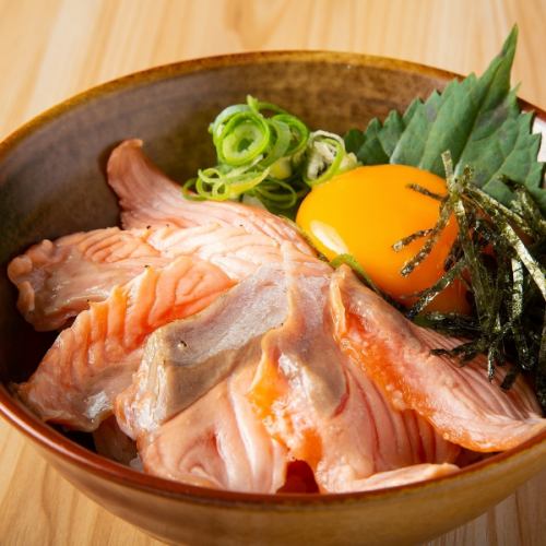 Mini bowl of seared marinated salmon with yolk