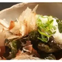 Deep-fried whole bell peppers in broth