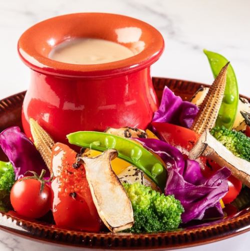 Bagna cauda with vegetables baked in a stone oven