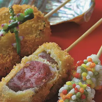 A 16-course omakase (chef's choice) menu featuring a comparison of A5-grade beef fillet and Japanese Black beef fillet skewers, with a welcome drink included.