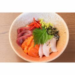Bowl of rice topped with sashimi