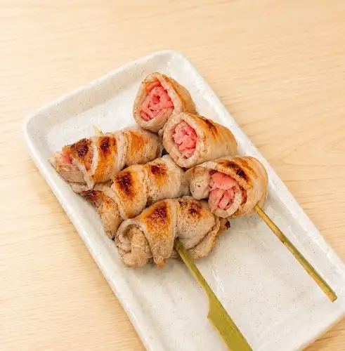 Pork skewers wrapped in sweet and sour ginger (2 skewers)