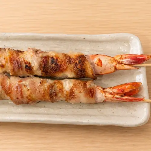 Shrimp and perilla leaf wrapped in pork skewers (2 skewers)