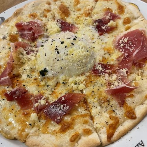 Carbonara pizza with raw ham and soft-boiled eggs