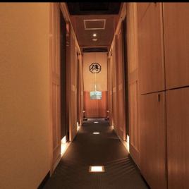 The corridor leading to the private room is also decorated with soft light.