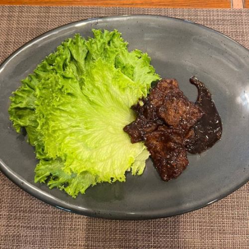 Beef stir-fried with sweet miso wrapped in lettuce