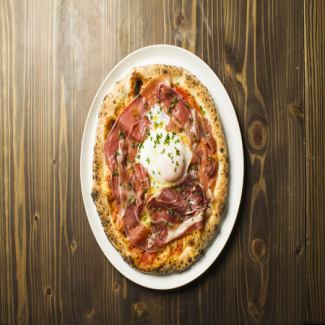 Bismarck pizza with soft-boiled eggs and prosciutto
