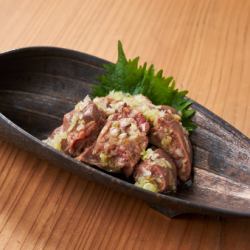 Toro liver covered in green onions