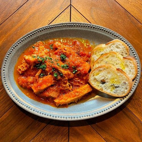 Tripe and chorizo stewed in tomato sauce