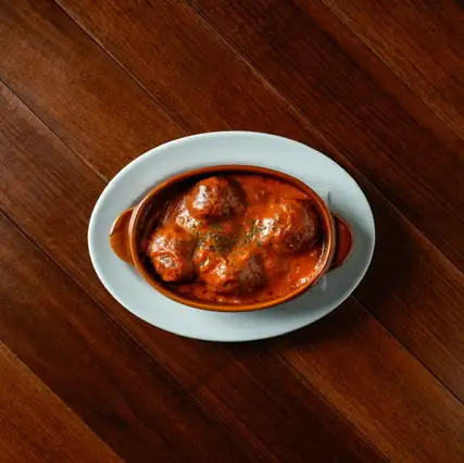 Wagyu beef meatballs simmered in tomato cream sauce