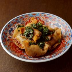 Bite-sized fried dumplings with garlic and chive sauce