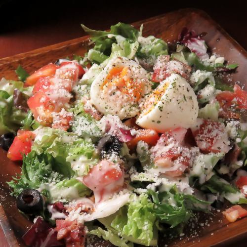 Caesar salad topped with soft-boiled eggs