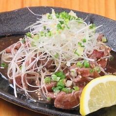 Beef tongue covered with green onion