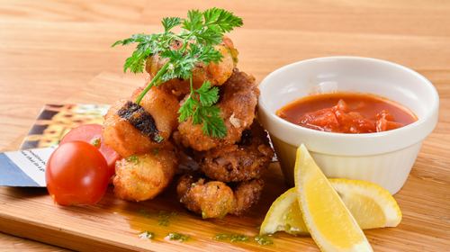 Fried octopus with basil tomato sauce