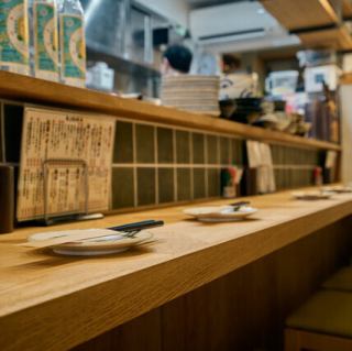 This seating is popular with solo diners, regulars, and casual dates! The open kitchen allows you to enjoy conversation with the staff.