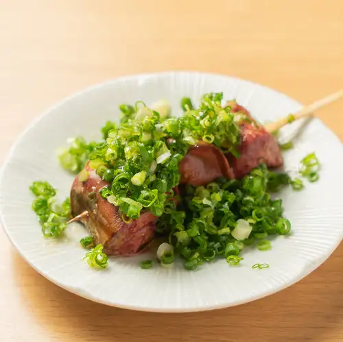 Seared liver covered in green onions