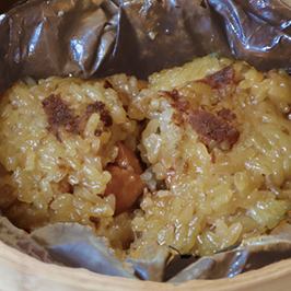 Salted egg rice dumplings wrapped in lotus leaves