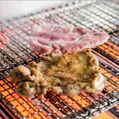 Grilled local fish, branded meat, and fresh vegetables from direct fire!