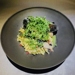 Genovese pasta fisilli with mussels, rock octopus, and shiso leaves