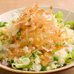 Onion salad with fried tempura bits and bonito flakes