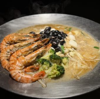 Clam and meat stew with seafood butter
