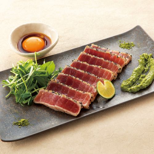 Rare medium fatty tuna steak with wasabi sauce and egg yolk soy sauce