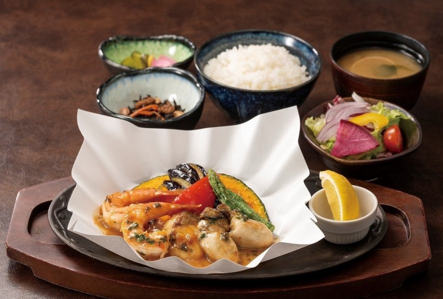Sea bream, shrimp, and oysters baked in a paper pot with butter soy sauce.