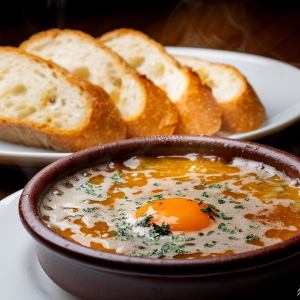 蟹身蟹味噌濃厚アヒージョ (バゲット4枚付き)