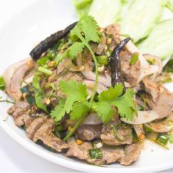 Spicy herb seasoned grilled beef "Nua Nam Tok"