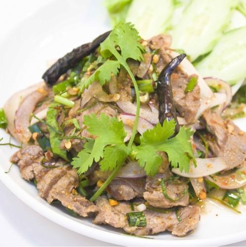 Spicy herb seasoned grilled beef "Nua Nam Tok"