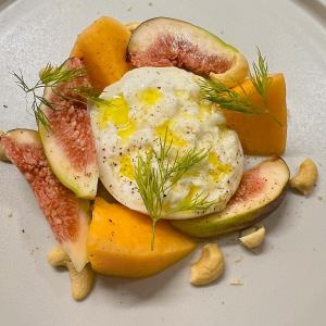 Burrata cheese and seasonal fruit caprese