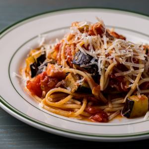 Homemade tomato sauce pasta with red eggplant and bacon