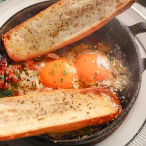 Runny egg and Iberian sausage ajillo