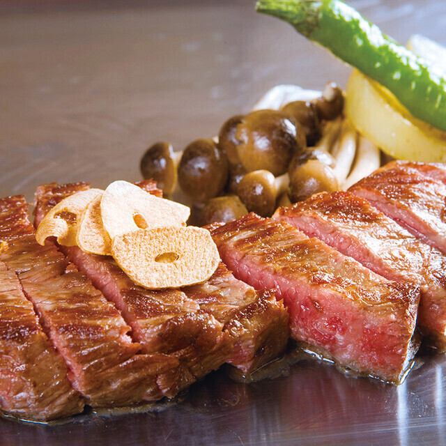 Enjoy the exquisite steaks grilled on a hot plate.