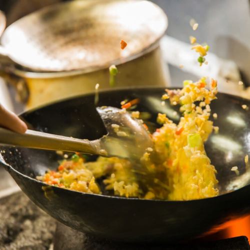 Fried rice prepared with expert techniques and homemade roast pork