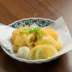 Tempura of hairtail fish with grated daikon radish and soy sauce dipping sauce