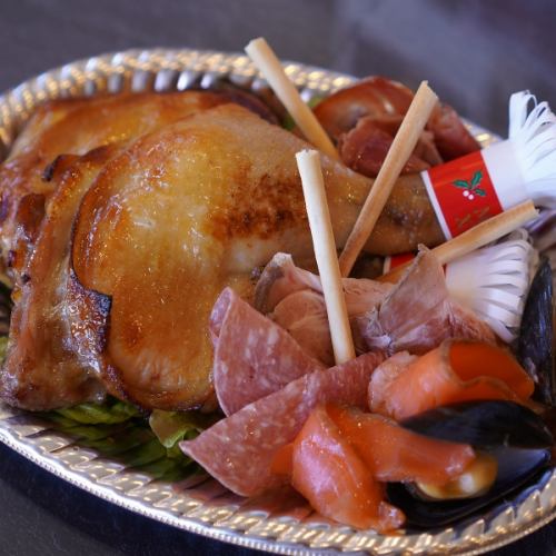 《骨付きローストチキン・デミグラスソース付き・1本&ミニオードブル》*写真は2本入りです。