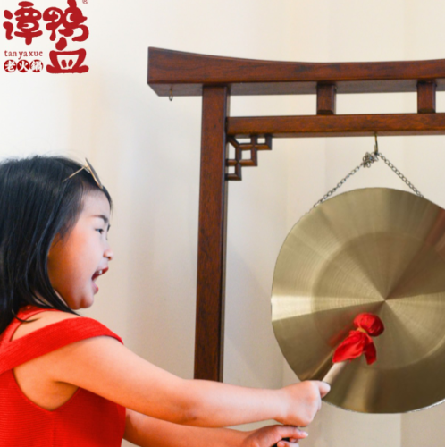 Experience playing traditional Chinese gongs