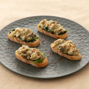 Oyster tartare bruschetta with yuzu pepper cream