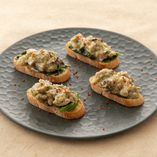 Oyster tartare bruschetta with yuzu pepper cream
