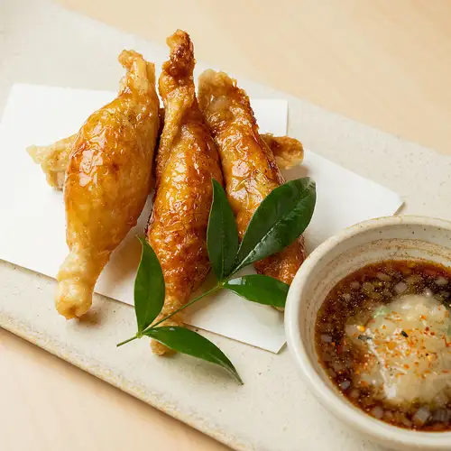 Chicken skin dumplings with green onion and salt ponzu sauce.