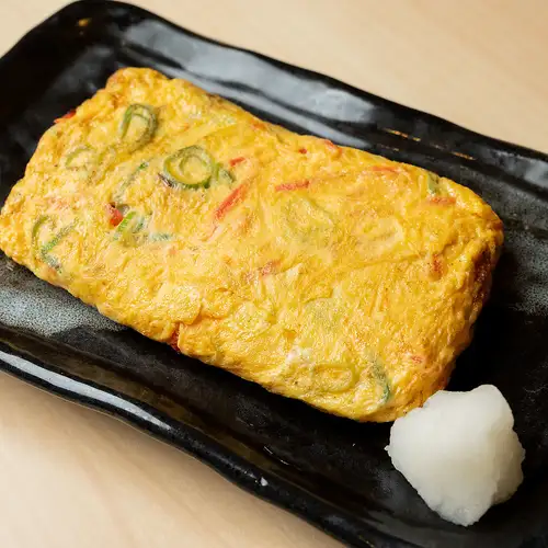 Rolled omelet with pickled ginger and plenty of green onions